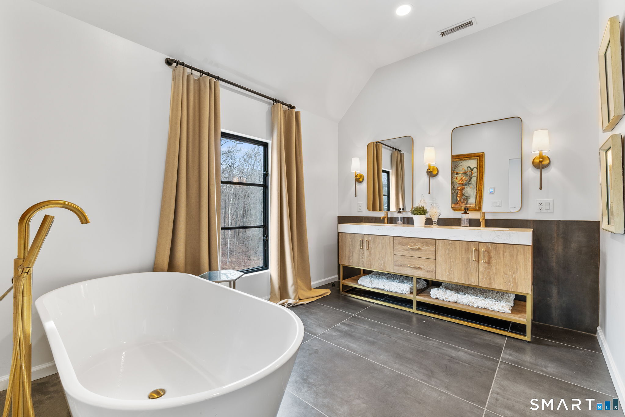 326 Thayer Pond Road Wilton, CT 06897 - Photo 16 of 40 a bathroom with a tub and a sink