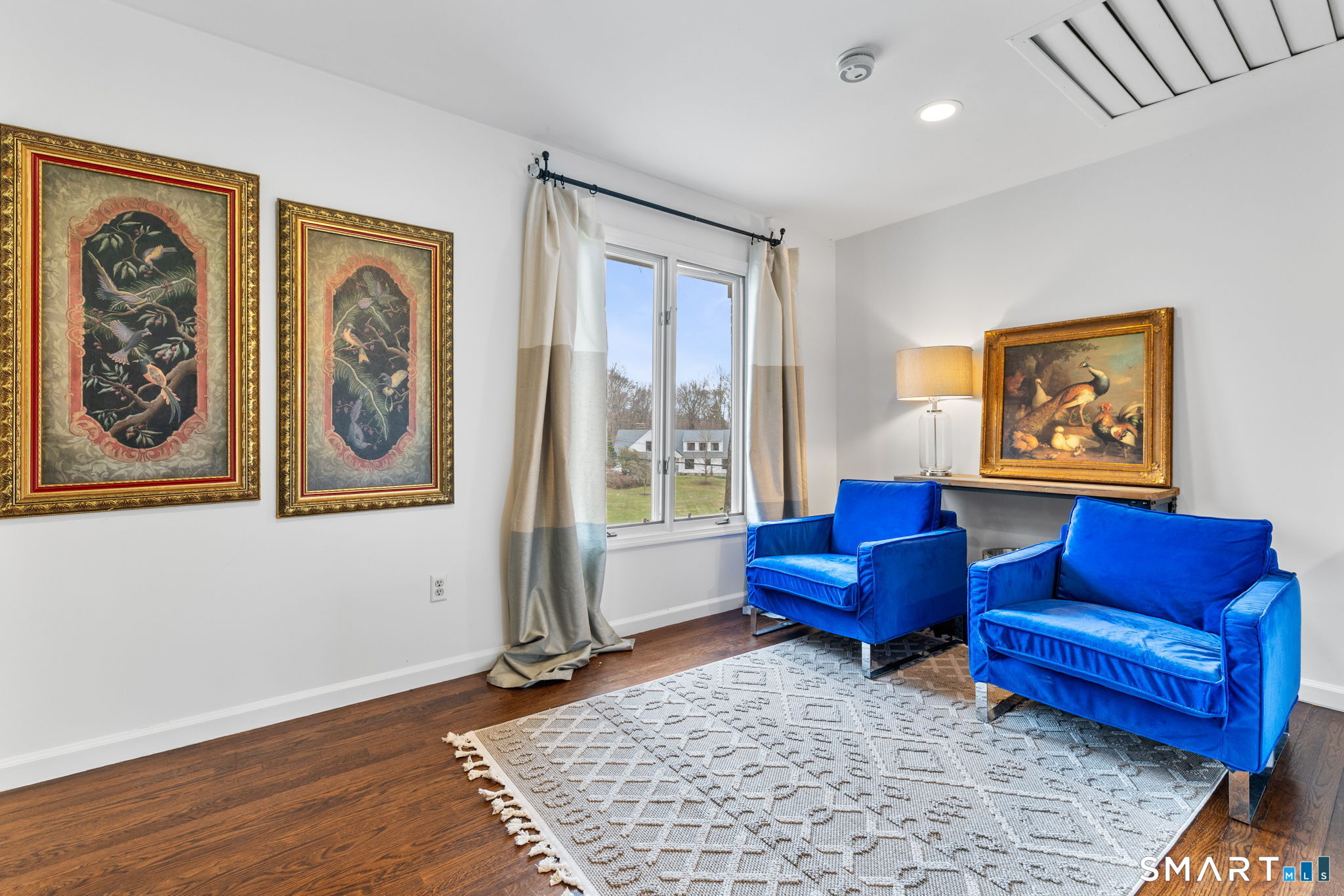 326 Thayer Pond Road Wilton, CT 06897 - Photo 20 of 40 a living room with furniture and a window