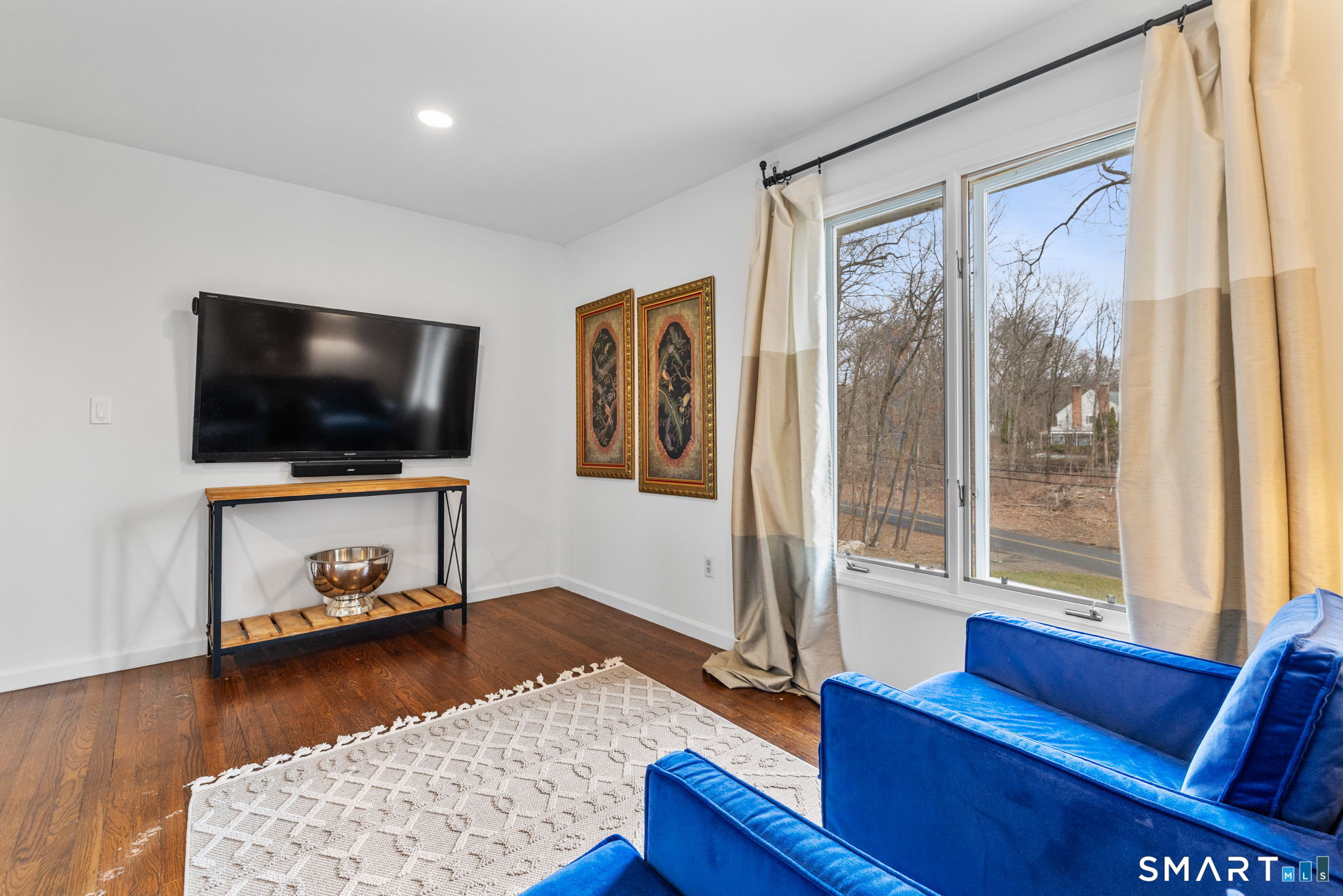 326 Thayer Pond Road Wilton, CT 06897 - Photo 21 of 40 a living room with furniture and a flat screen tv