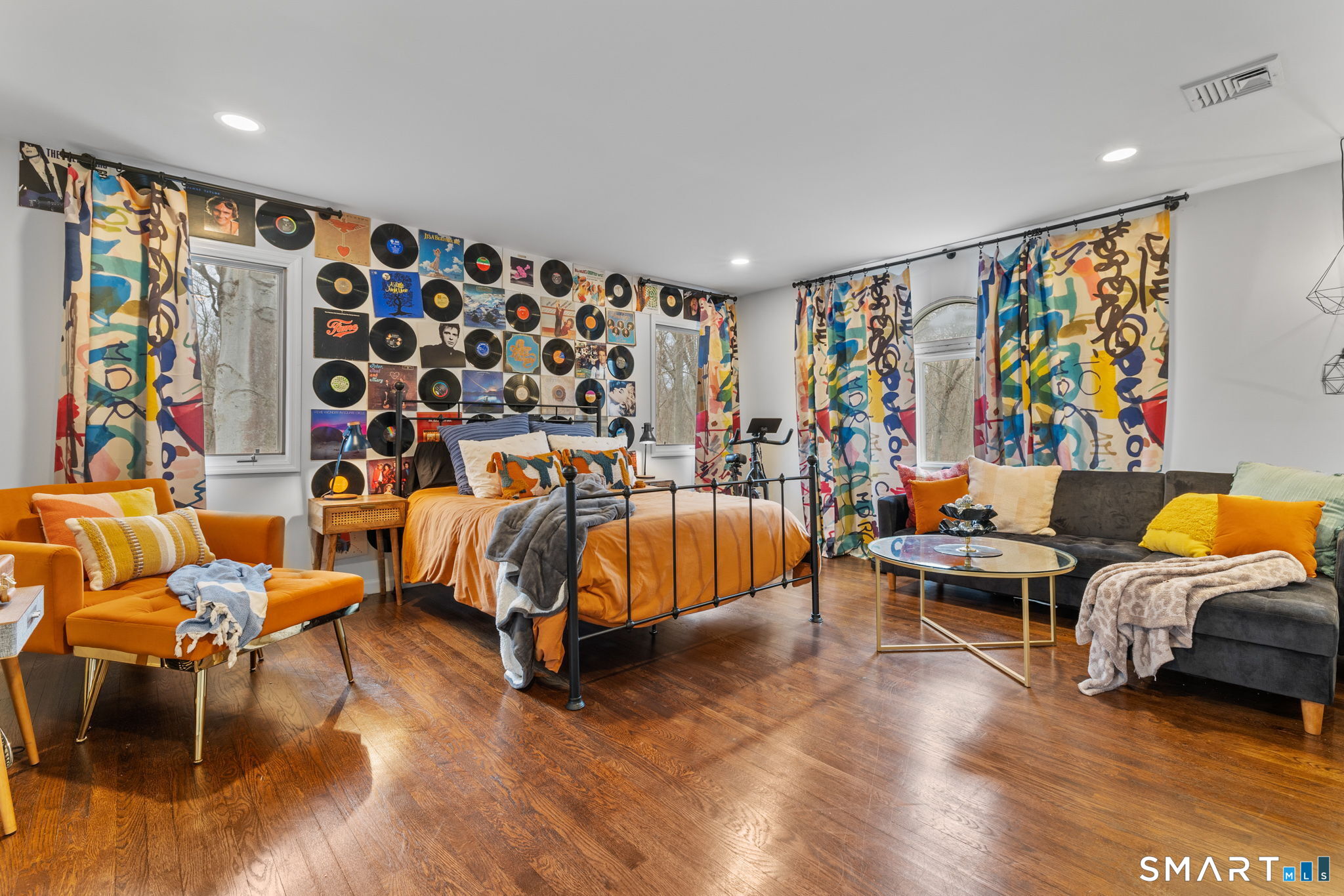 326 Thayer Pond Road Wilton, CT 06897 - Photo 25 of 40 a living room with furniture a rug and a flat screen tv