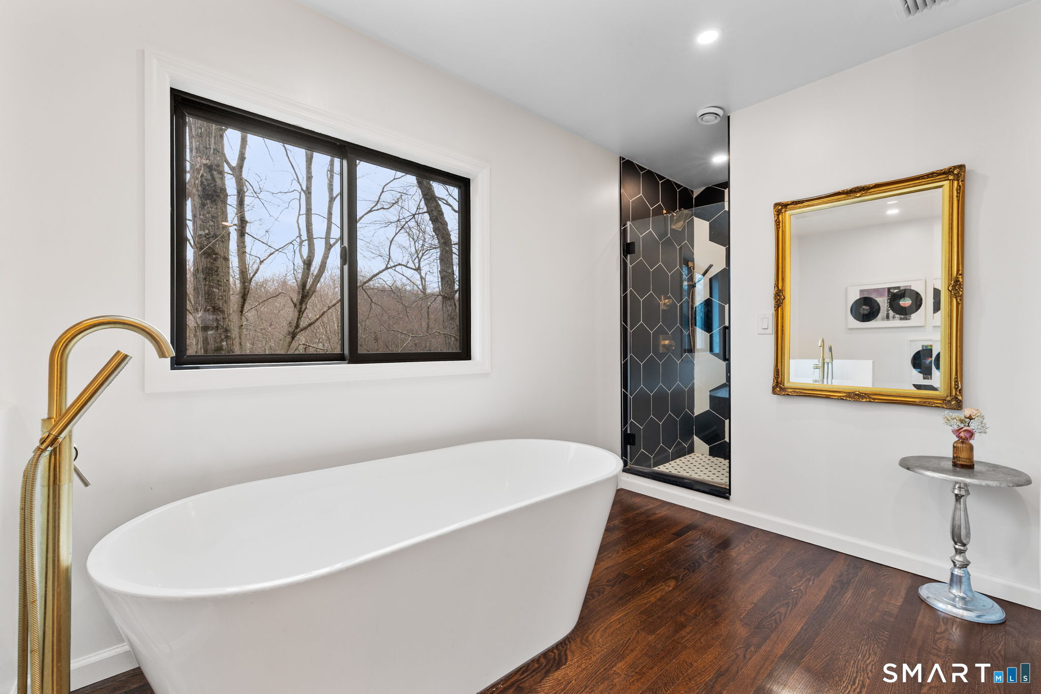 326 Thayer Pond Road Wilton, CT 06897 - Photo 26 of 40 a white bath tub sitting in a bathroom