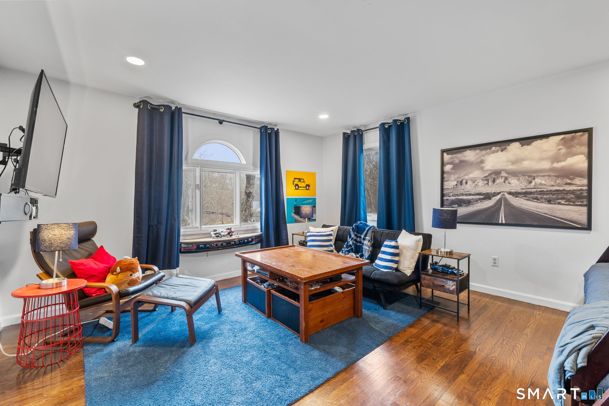 326 Thayer Pond Road Wilton, CT 06897 - Photo 29 of 40 a living room with furniture and wooden floor