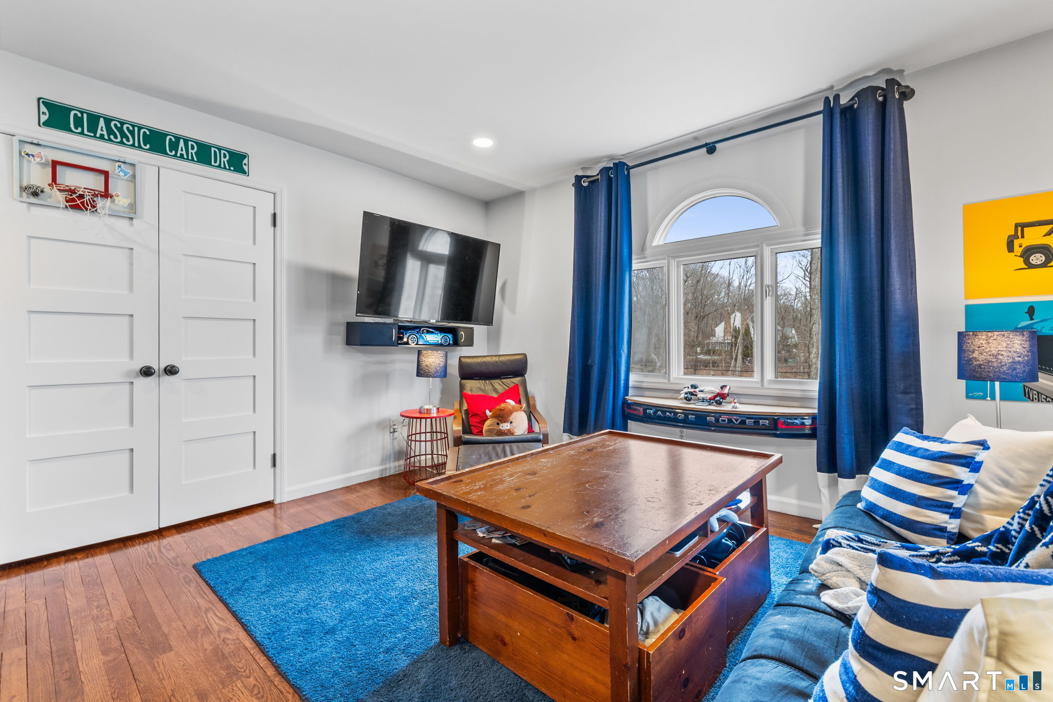 326 Thayer Pond Road Wilton, CT 06897 - Photo 31 of 40 a room with furniture and a flat screen tv