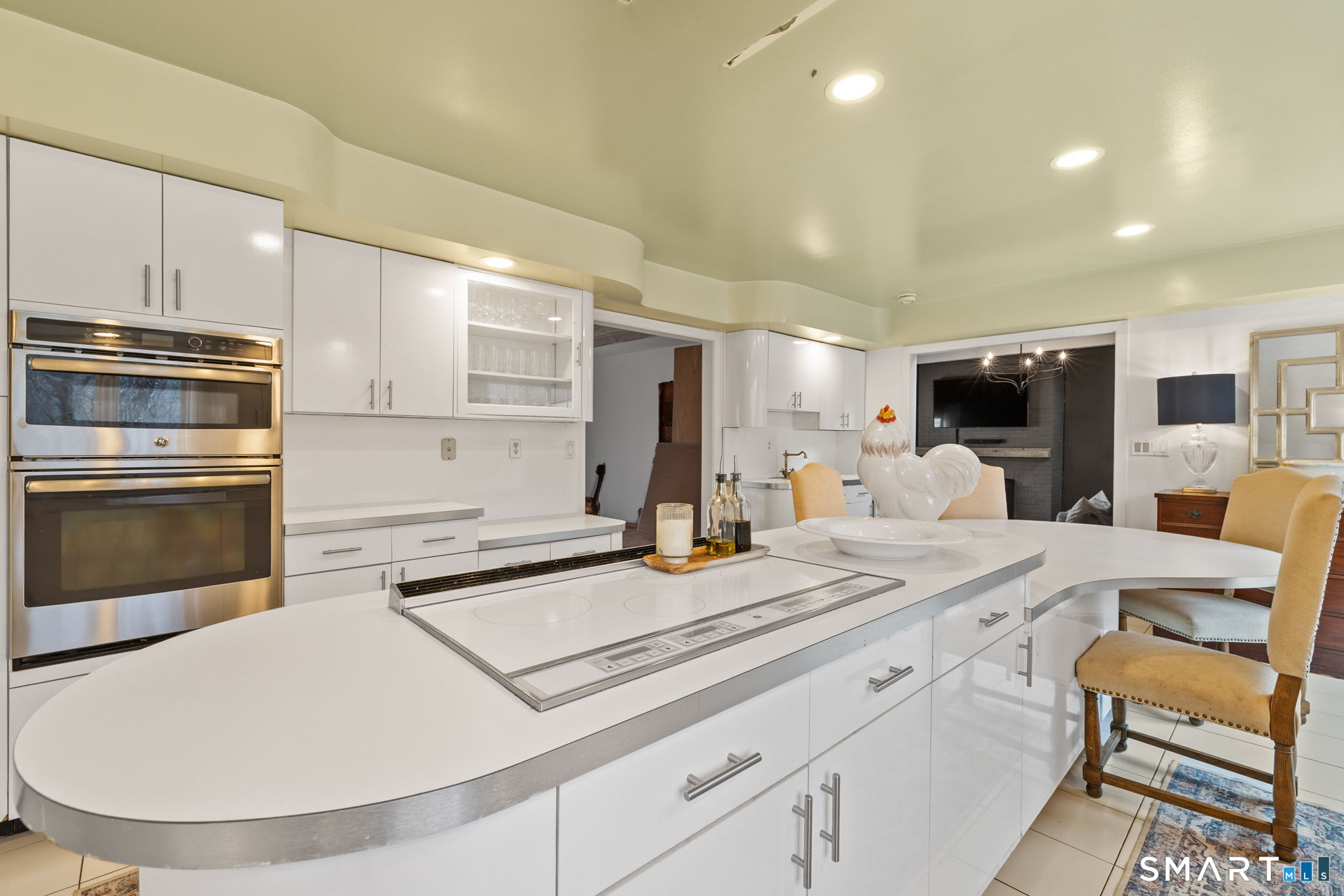 326 Thayer Pond Road Wilton, CT 06897 - Photo 35 of 40 a kitchen with a sink stainless steel appliances and white cabinets
