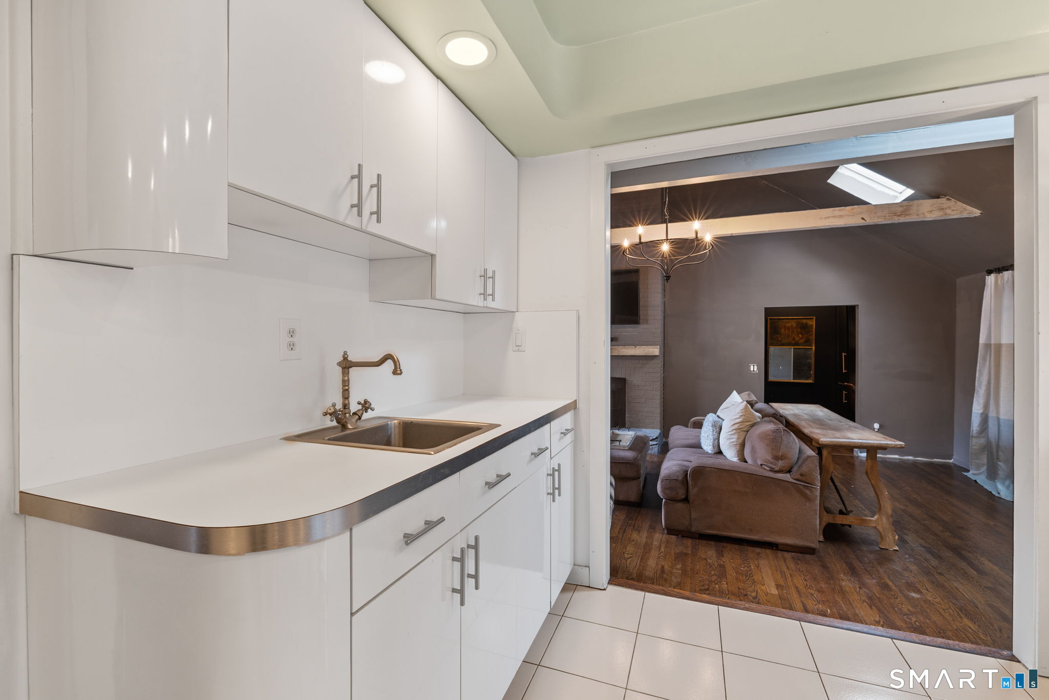 326 Thayer Pond Road Wilton, CT 06897 - Photo 36 of 40 a en suite bathroom with a double vanity sink and a mirror