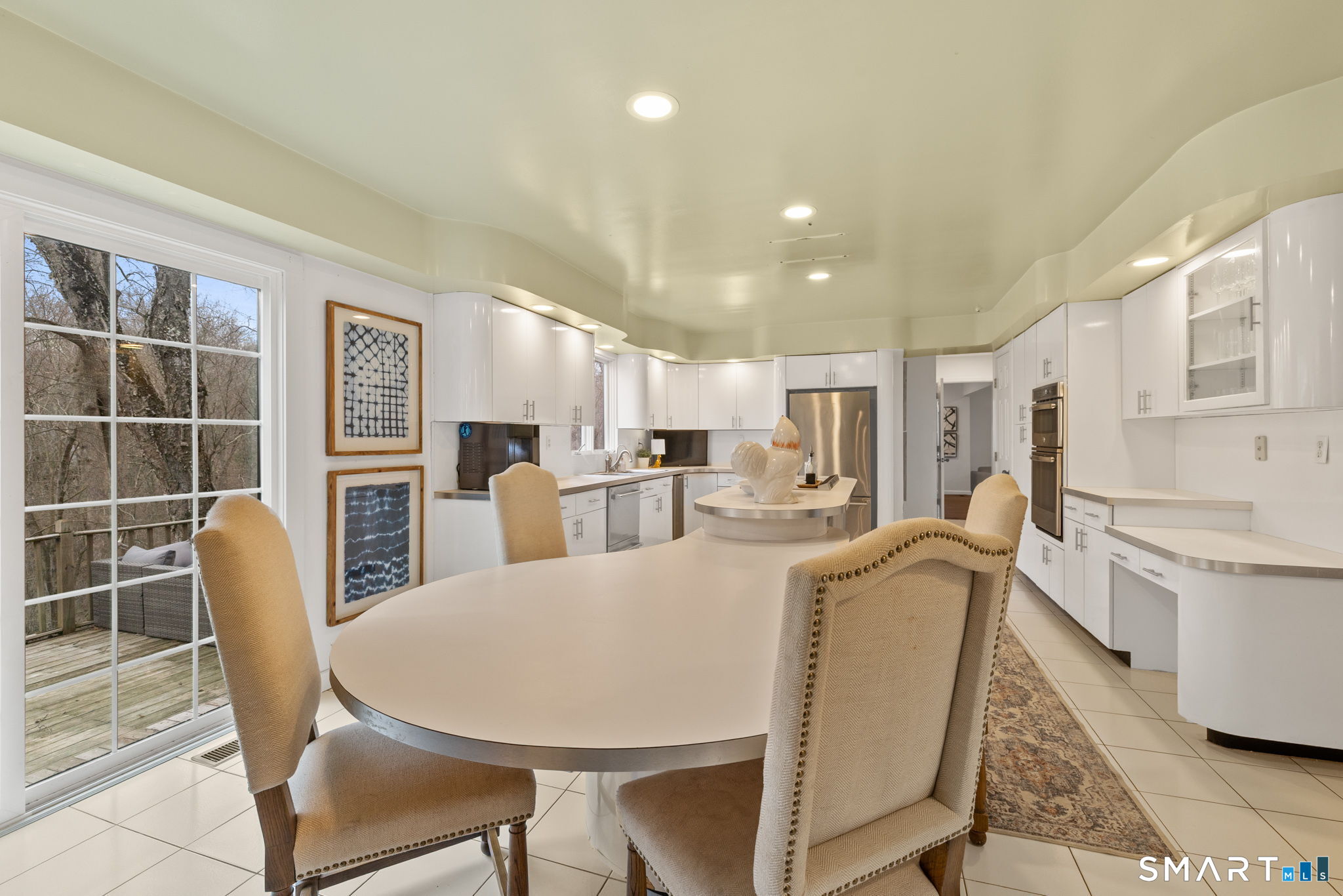 326 Thayer Pond Road Wilton, CT 06897 - Photo 37 of 40 a view of a dining room with furniture and wooden floor