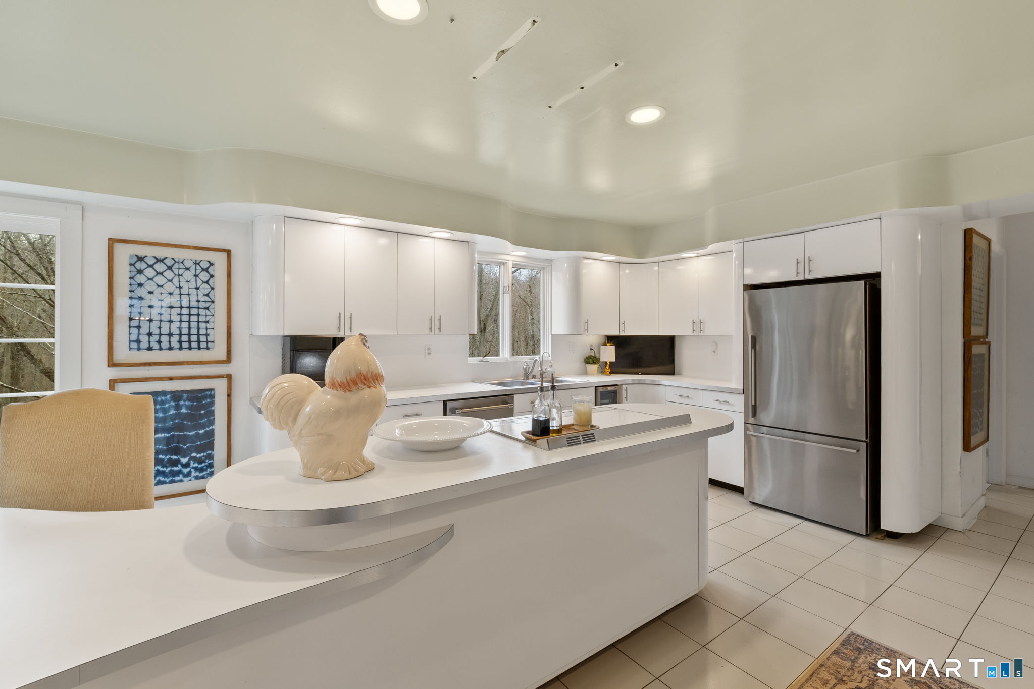 326 Thayer Pond Road Wilton, CT 06897 - Photo 38 of 40 a kitchen with stainless steel appliances a refrigerator sink and cabinets