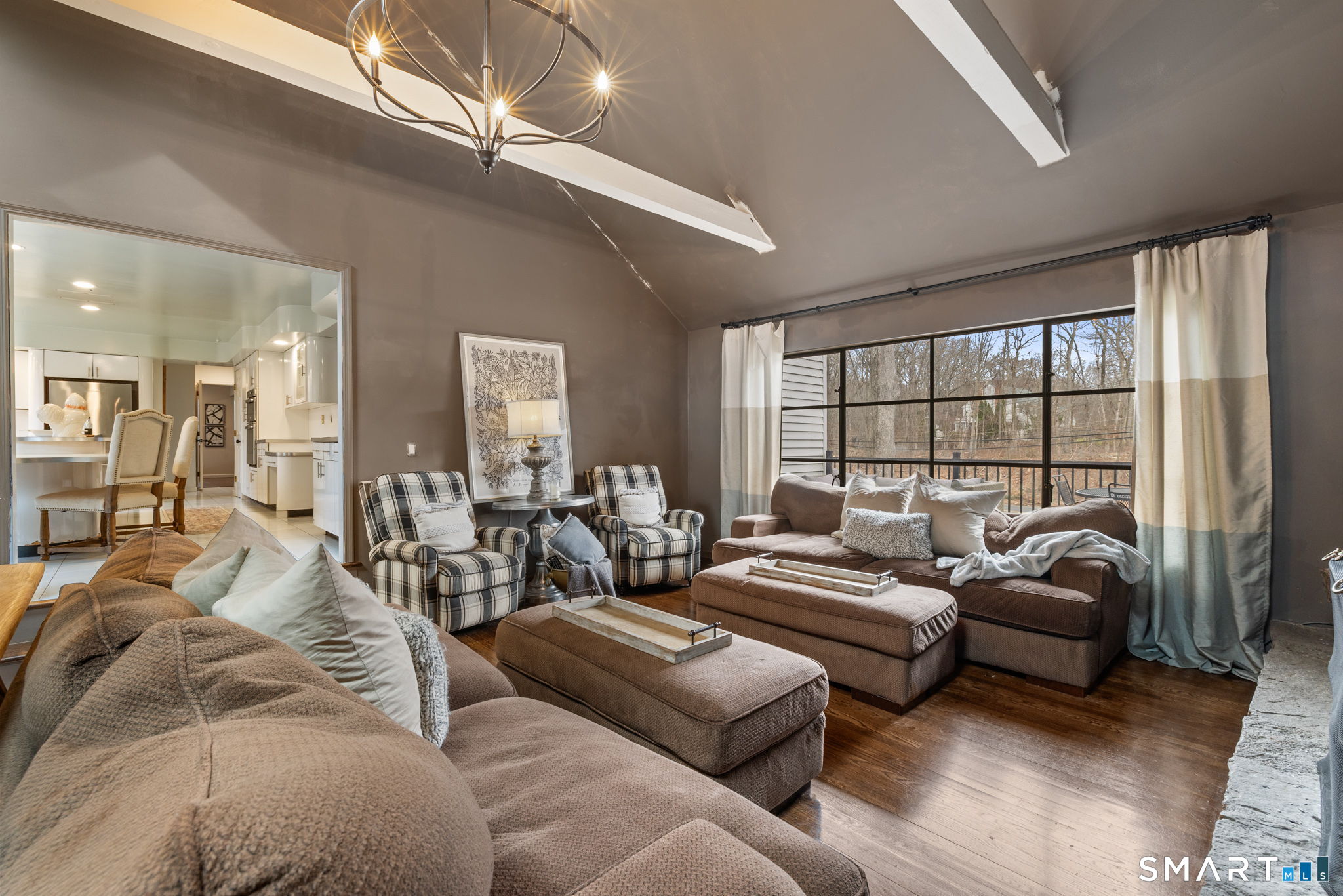 326 Thayer Pond Road Wilton, CT 06897 - Photo 5 of 40 a living room with furniture and a large window