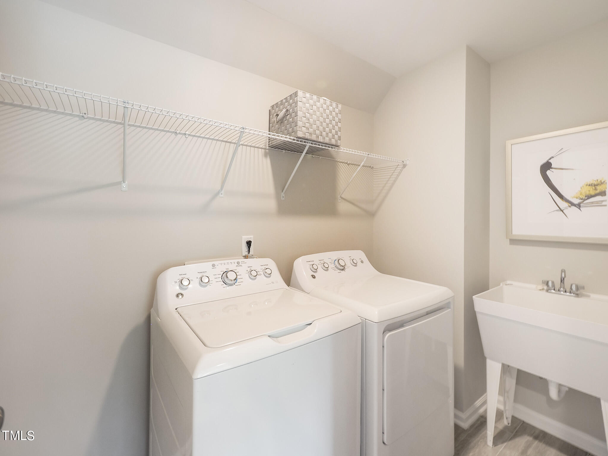 349 Glacier Lk Drive, Unit 271 Raleigh, NC 27610 - Photo 18 of 28 a utility room with dryer and washer