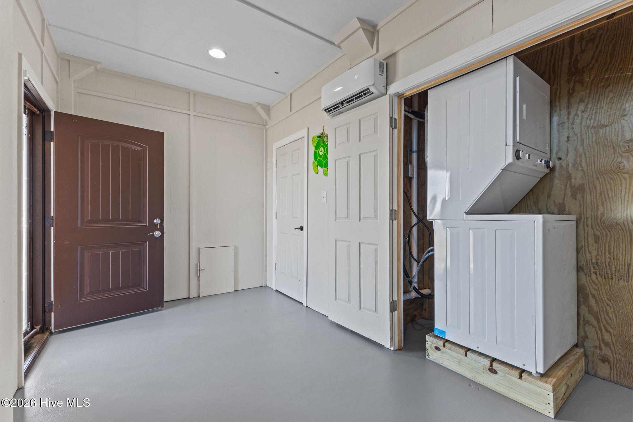616 Nelson Neck Road Sealevel, NC 28577 - Photo 6 of 54 First floor entry with storage closet and washer and dryer.