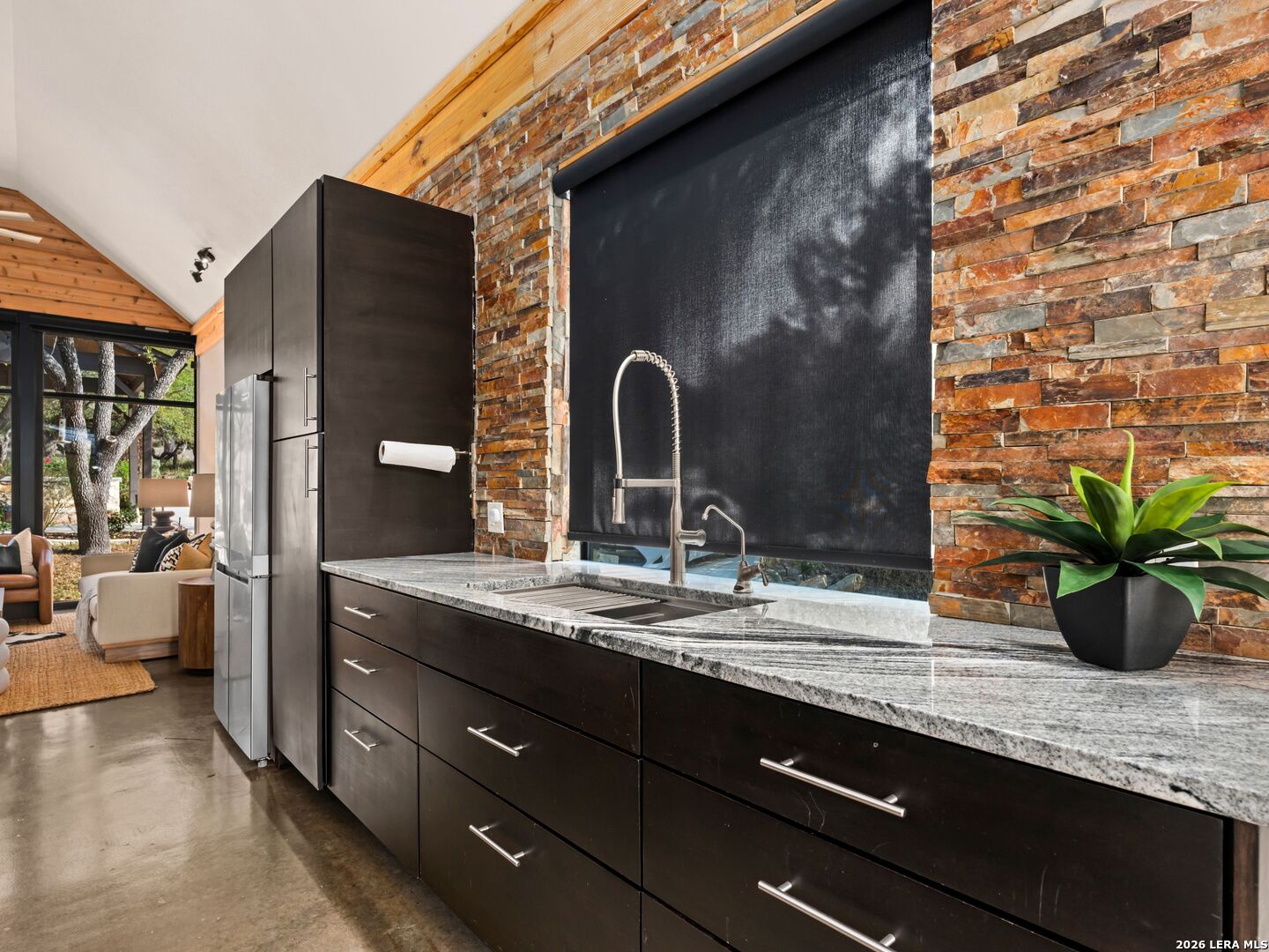 1146 Victoria Avenue Spring Branch, TX 78070 - Photo 21 of 89 a bathroom with a granite countertop sink and a mirror