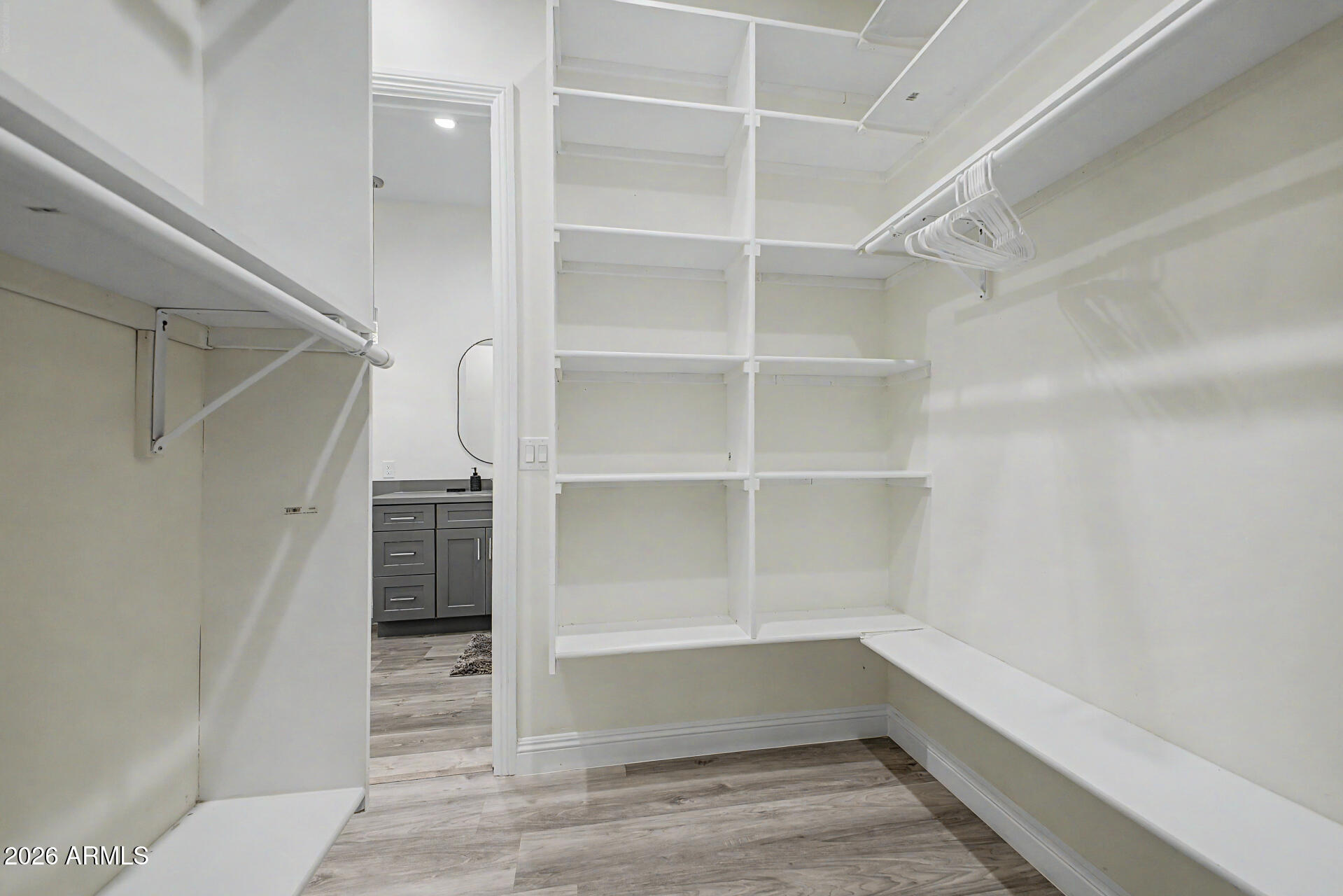 1344 East Polk Street, Unit B Phoenix, AZ 85006 - Photo 14 of 27 a view of walk in closet with empty racks