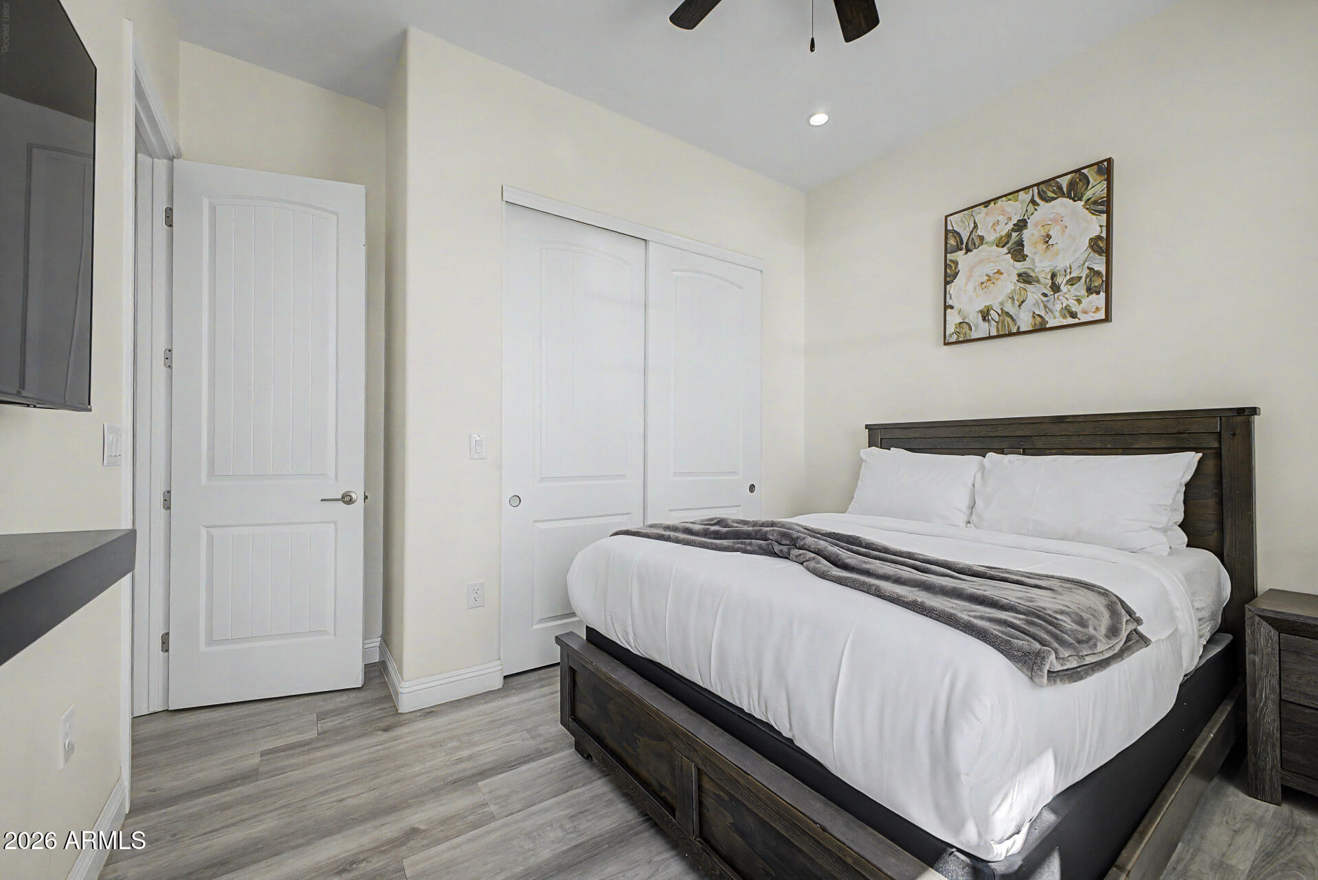 1344 East Polk Street, Unit B Phoenix, AZ 85006 - Photo 20 of 27 a bedroom with a bed and a painting on the wall