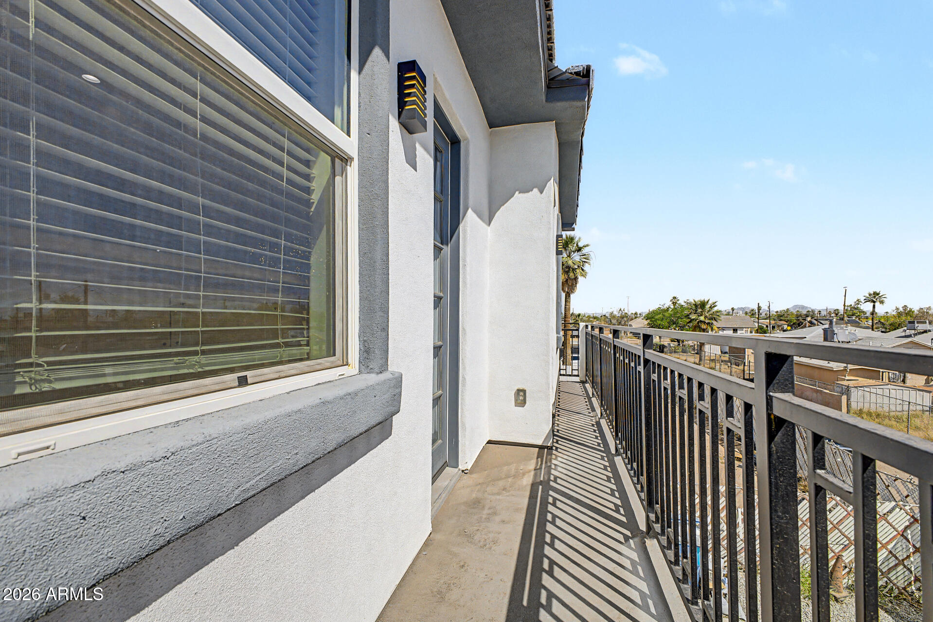 1344 East Polk Street, Unit B Phoenix, AZ 85006 - Photo 23 of 27 a view of a balcony with furniture