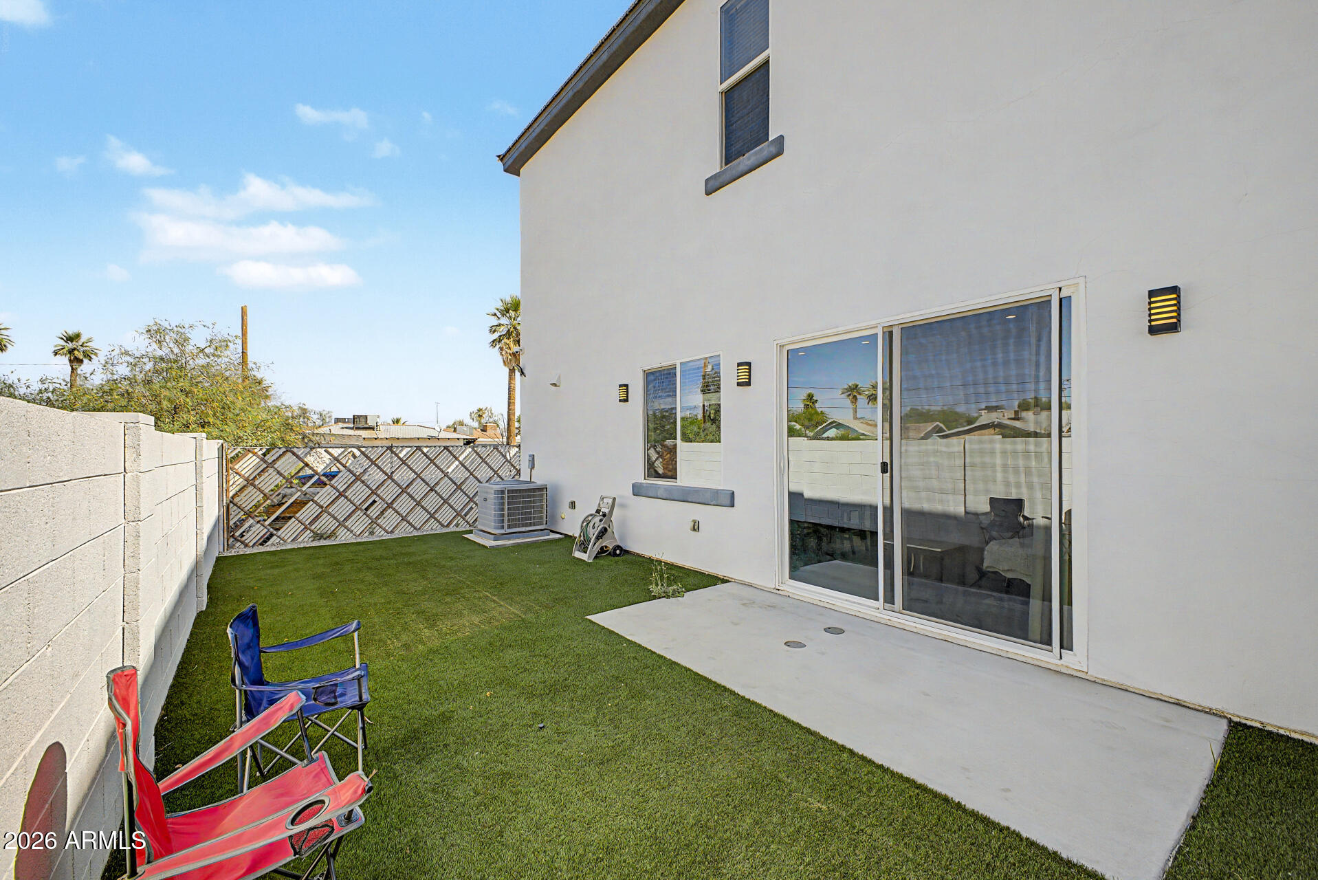 1344 East Polk Street, Unit B Phoenix, AZ 85006 - Photo 26 of 27 a bedroom with furniture and a baby crib