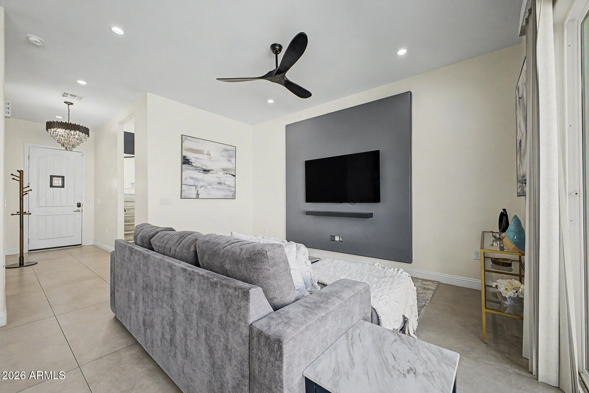 1344 East Polk Street, Unit B Phoenix, AZ 85006 - Photo 6 of 27 a living room with furniture and a flat screen tv