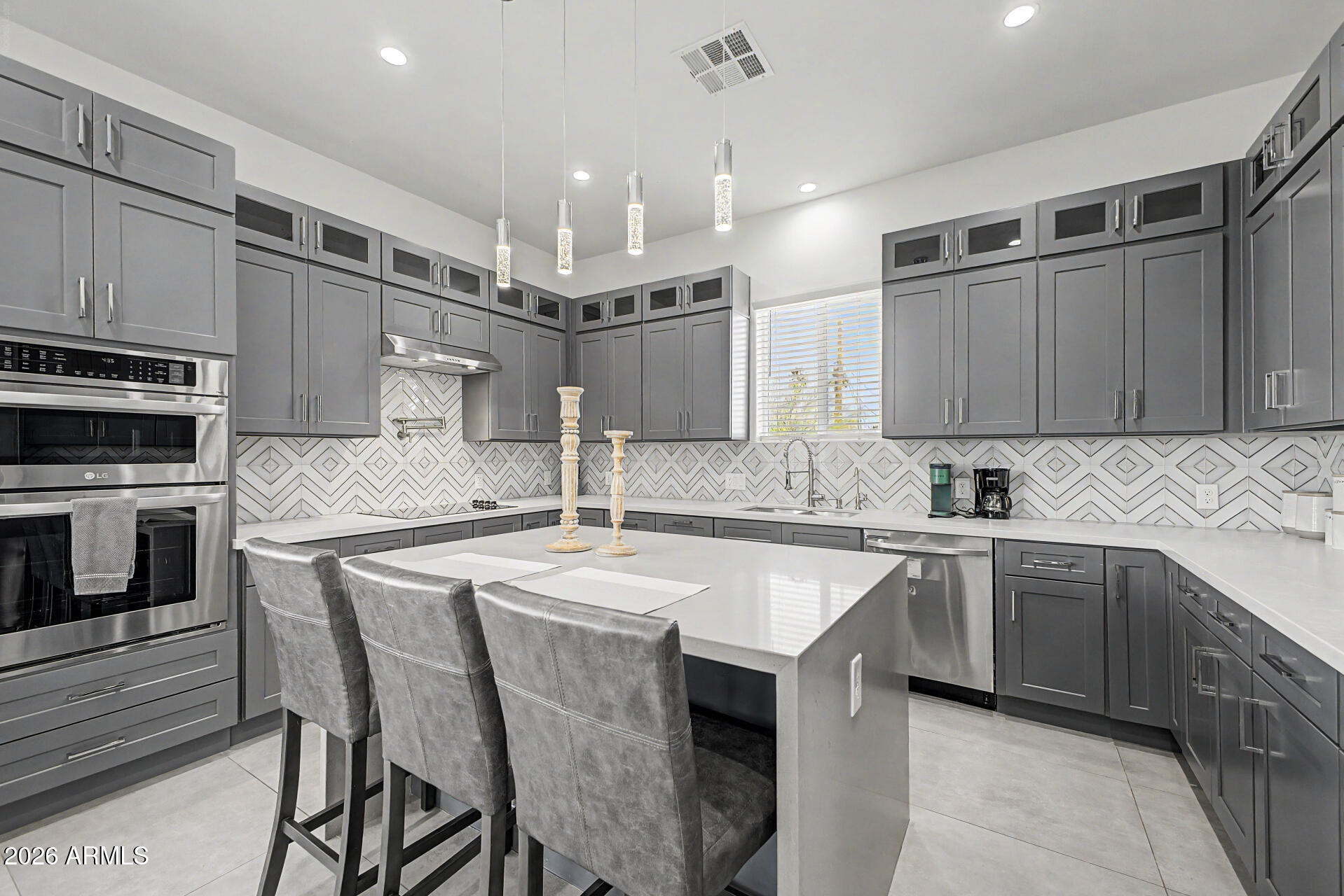 1344 East Polk Street, Unit B Phoenix, AZ 85006 - Photo 7 of 27 a kitchen with stainless steel appliances granite countertop a sink and microwave