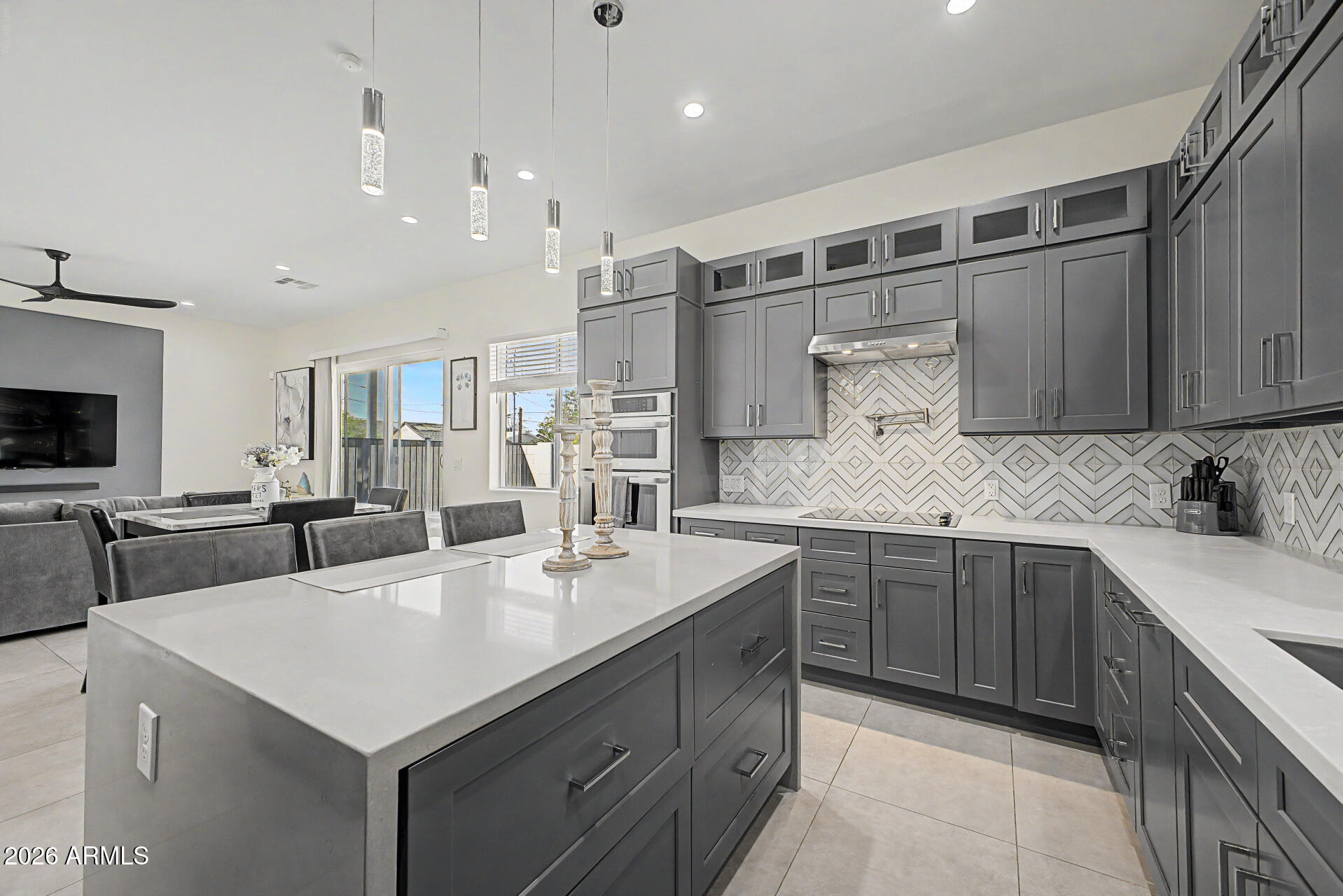 1344 East Polk Street, Unit B Phoenix, AZ 85006 - Photo 8 of 27 a kitchen with a sink a stove and cabinets