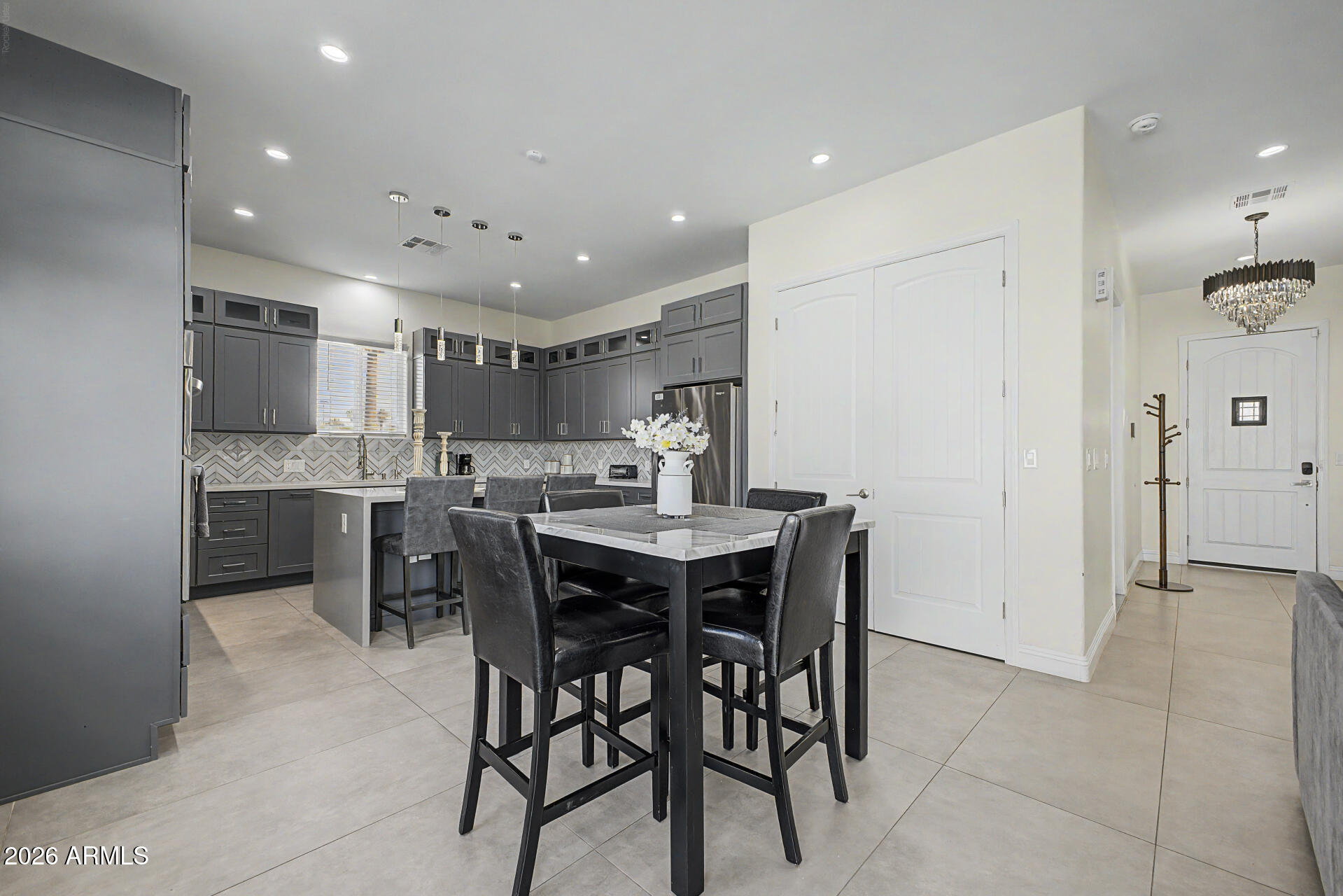 1344 East Polk Street, Unit B Phoenix, AZ 85006 - Photo 9 of 27 a kitchen with a table and chairs in it