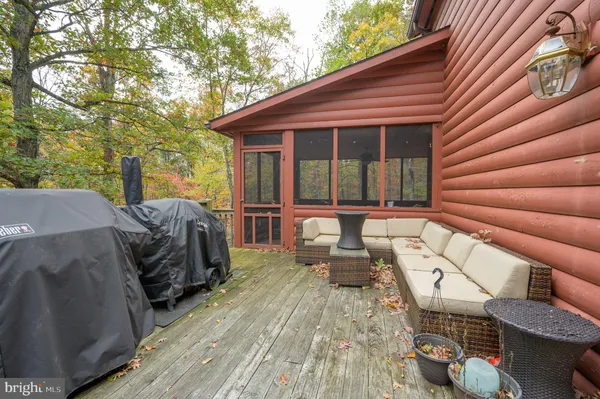 a view of a house with a yard and wooden fence
