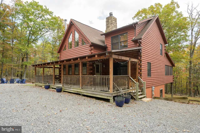 a view of a house with a snow in the background