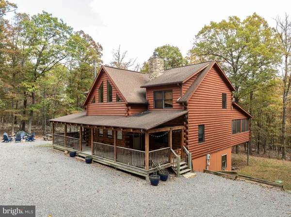 a bedroom with a bed and a table
