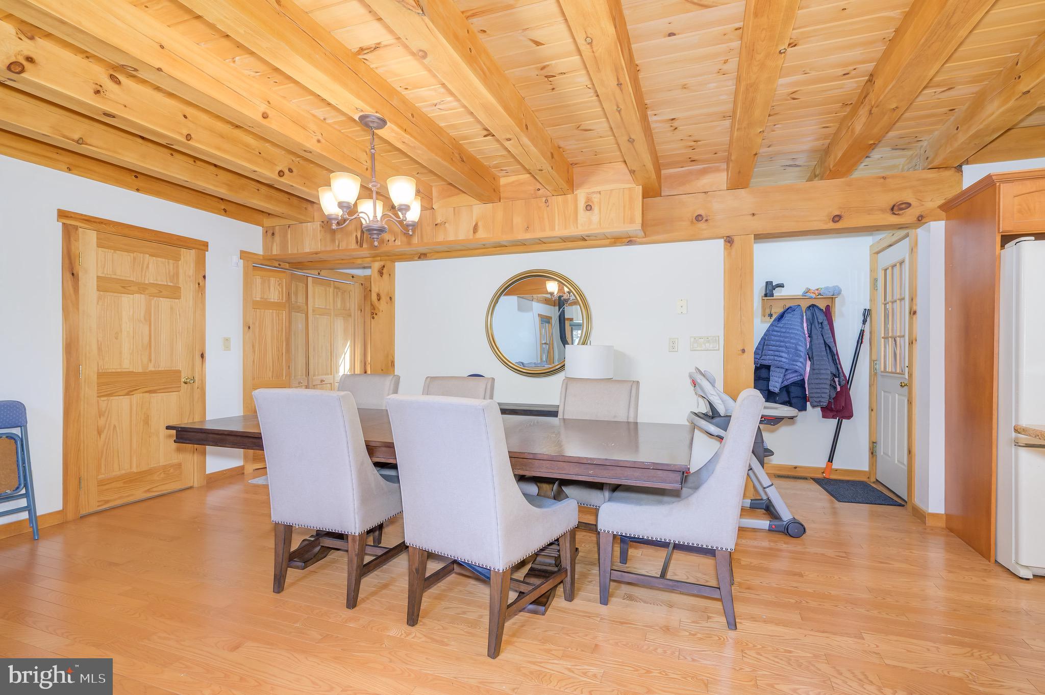 456 Parkside Terrace Berkeley Springs, WV 25411 - Photo 43 of 102 a view of a dining room with furniture and wooden floor