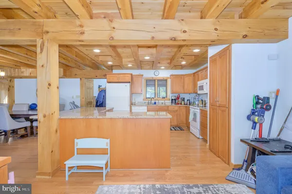 a view of a house with a yard covered in snow