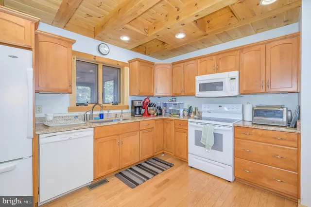 a view of backyard with seating space