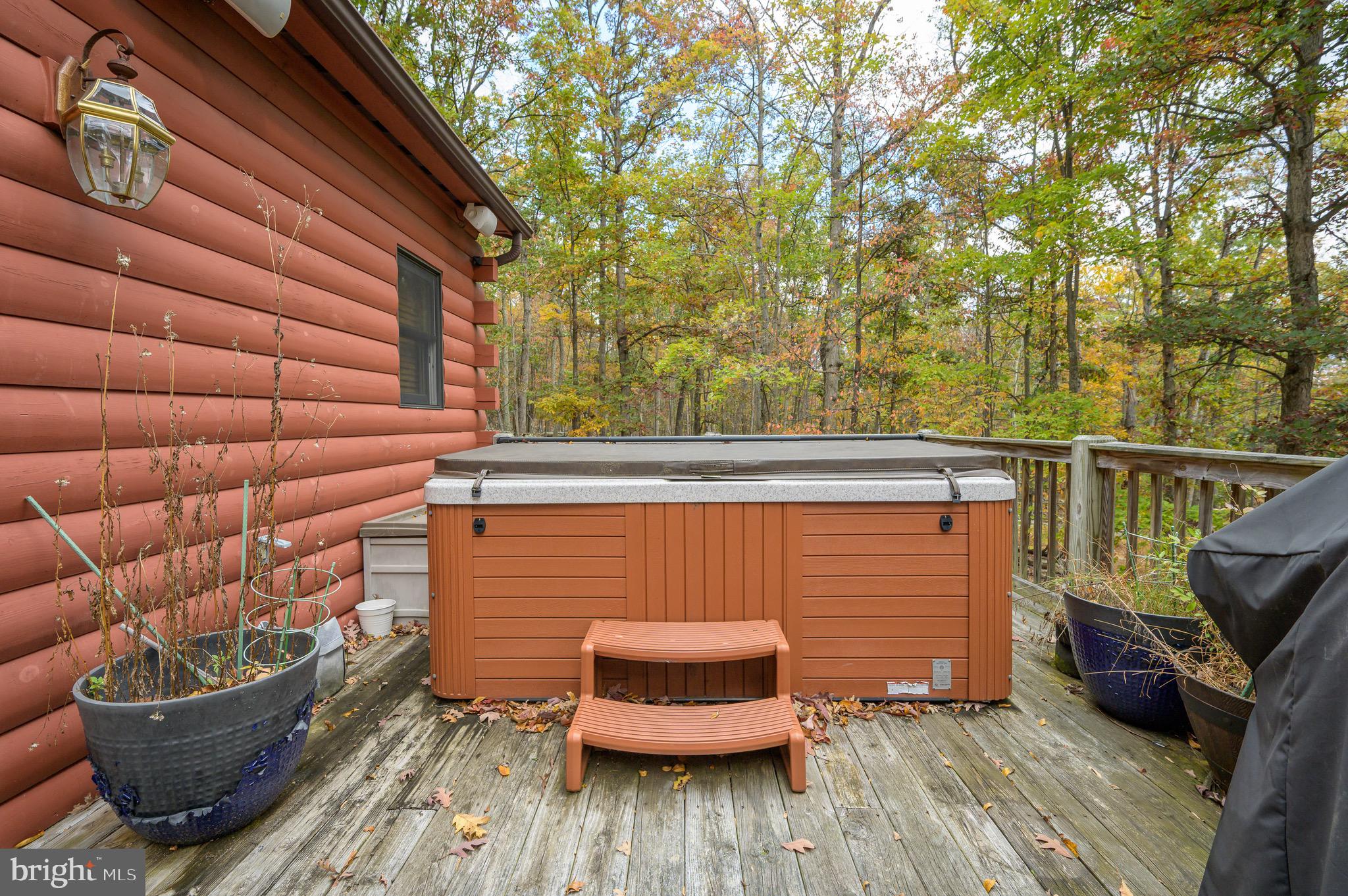 456 Parkside Terrace Berkeley Springs, WV 25411 - Photo 53 of 102 a backyard of a house with wooden floor and outdoor seating