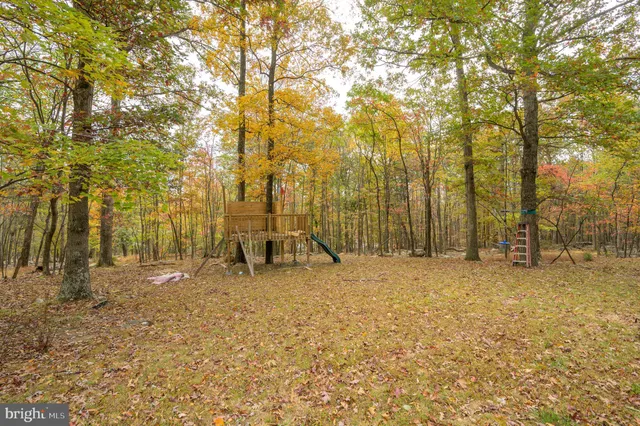 an aerial view of residential house with outdoor space