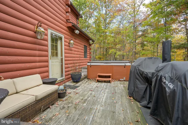 an aerial view of a house with swimming pool and sitting space