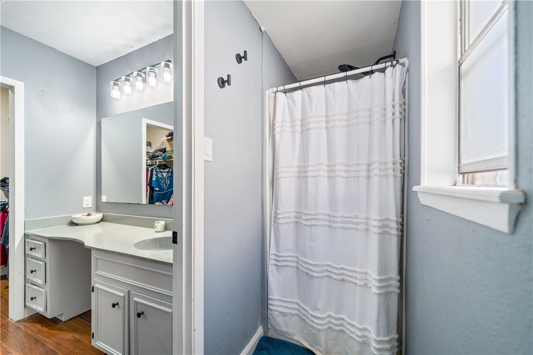 2217 Post Oak Drive Portland, TX 78374 - Photo 22 of 39 a bathroom with a double vanity sink and mirror