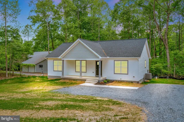 a view of house with a swimming pool