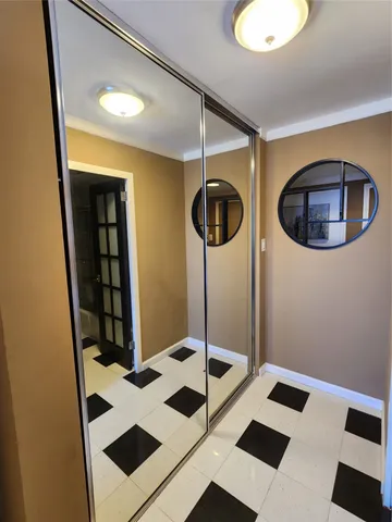 a living room with furniture a rug and a chandelier