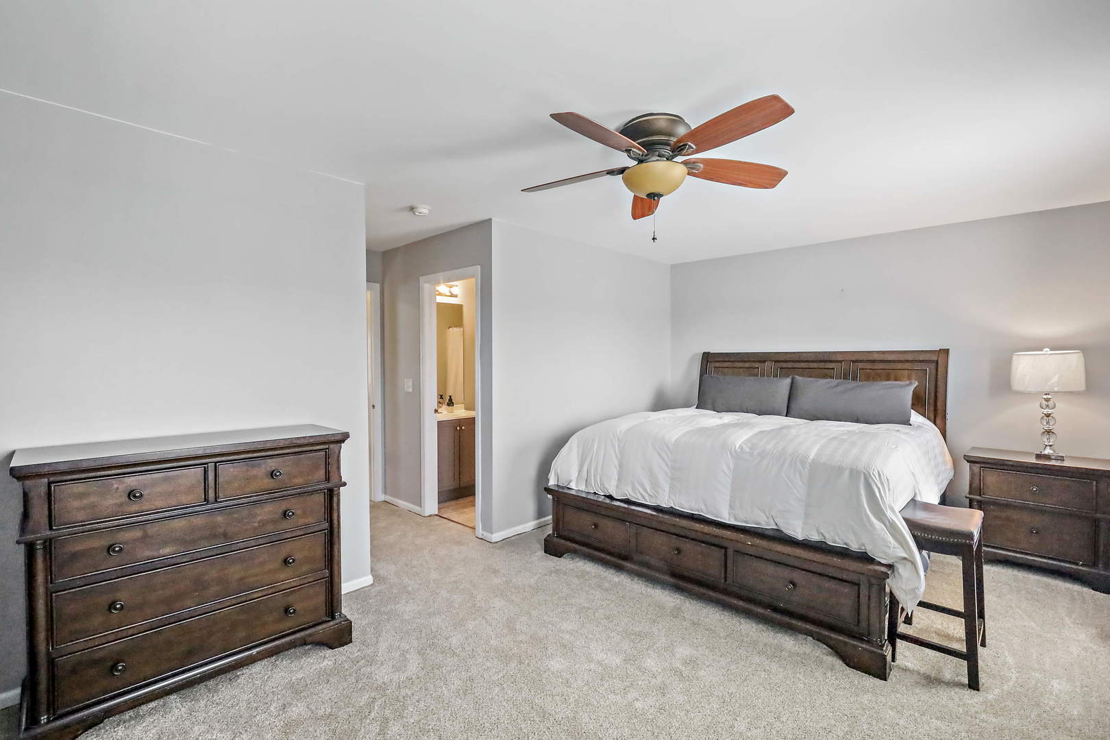 25294 Faraday Road Manhattan, IL 60442 - Photo 12 of 16 a bedroom with a bed and ceiling fan
