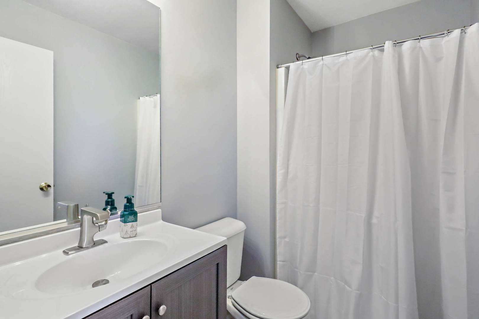 25294 Faraday Road Manhattan, IL 60442 - Photo 13 of 16 a bathroom with a sink and a mirror