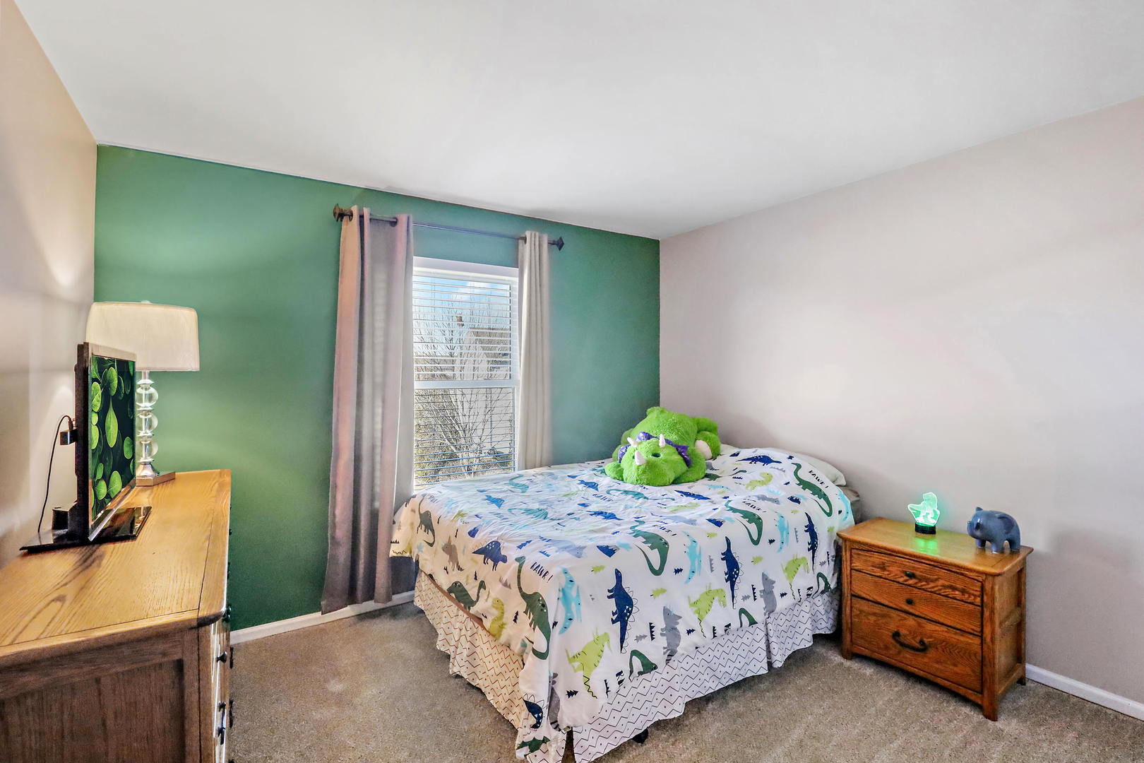 25294 Faraday Road Manhattan, IL 60442 - Photo 14 of 16 a bedroom with a bed and a table in it