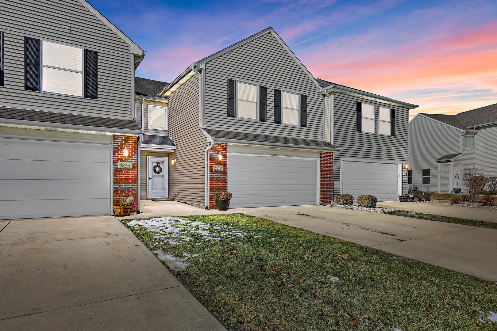 25294 Faraday Road Manhattan, IL 60442 - Photo 2 of 16 a front view of a house with a yard