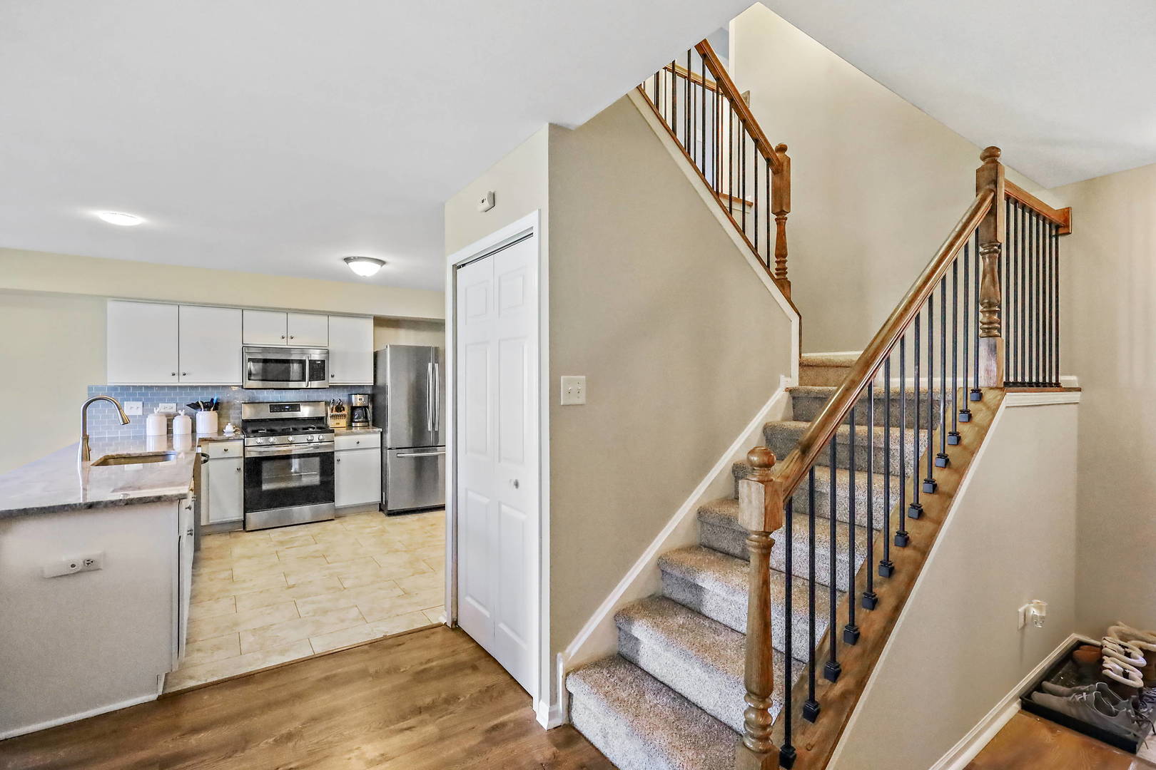 25294 Faraday Road Manhattan, IL 60442 - Photo 6 of 16 a view of a kitchen with wooden floor and electronic appliances