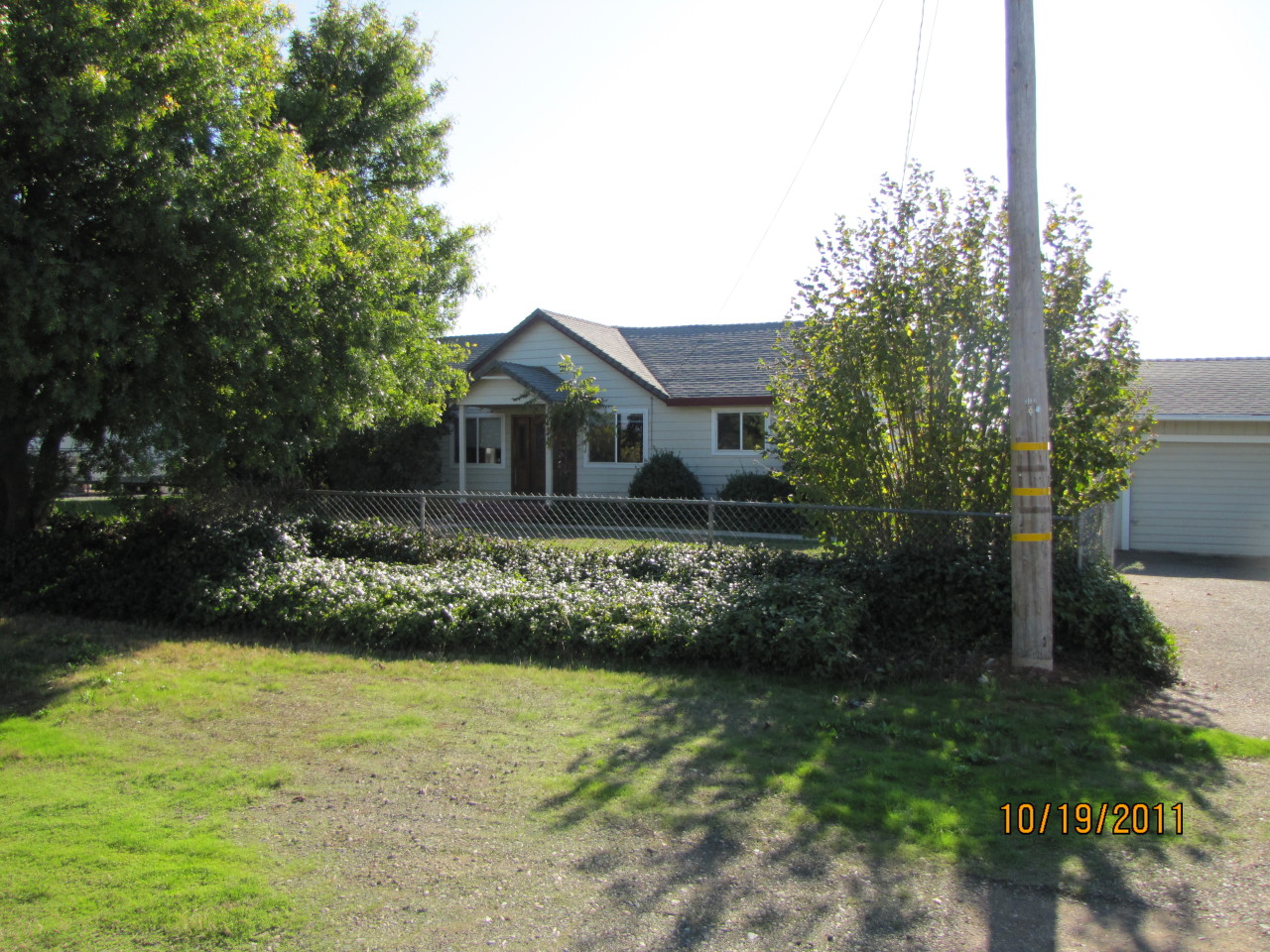 4604 Webb Road Anderson, CA 96007 - Photo 1 of 9 a front view of a house with a garden
