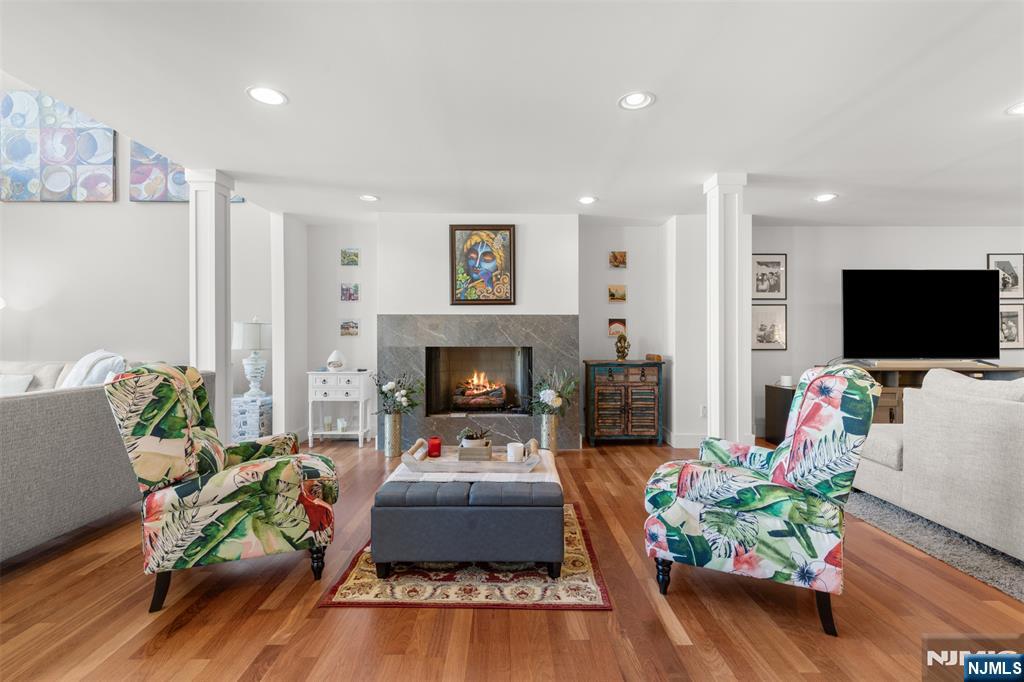 7 Oakdene Terrace, Unit 7 Edgewater, NJ 07020 - Photo 5 of 30 a living room with furniture fireplace and flat screen tv