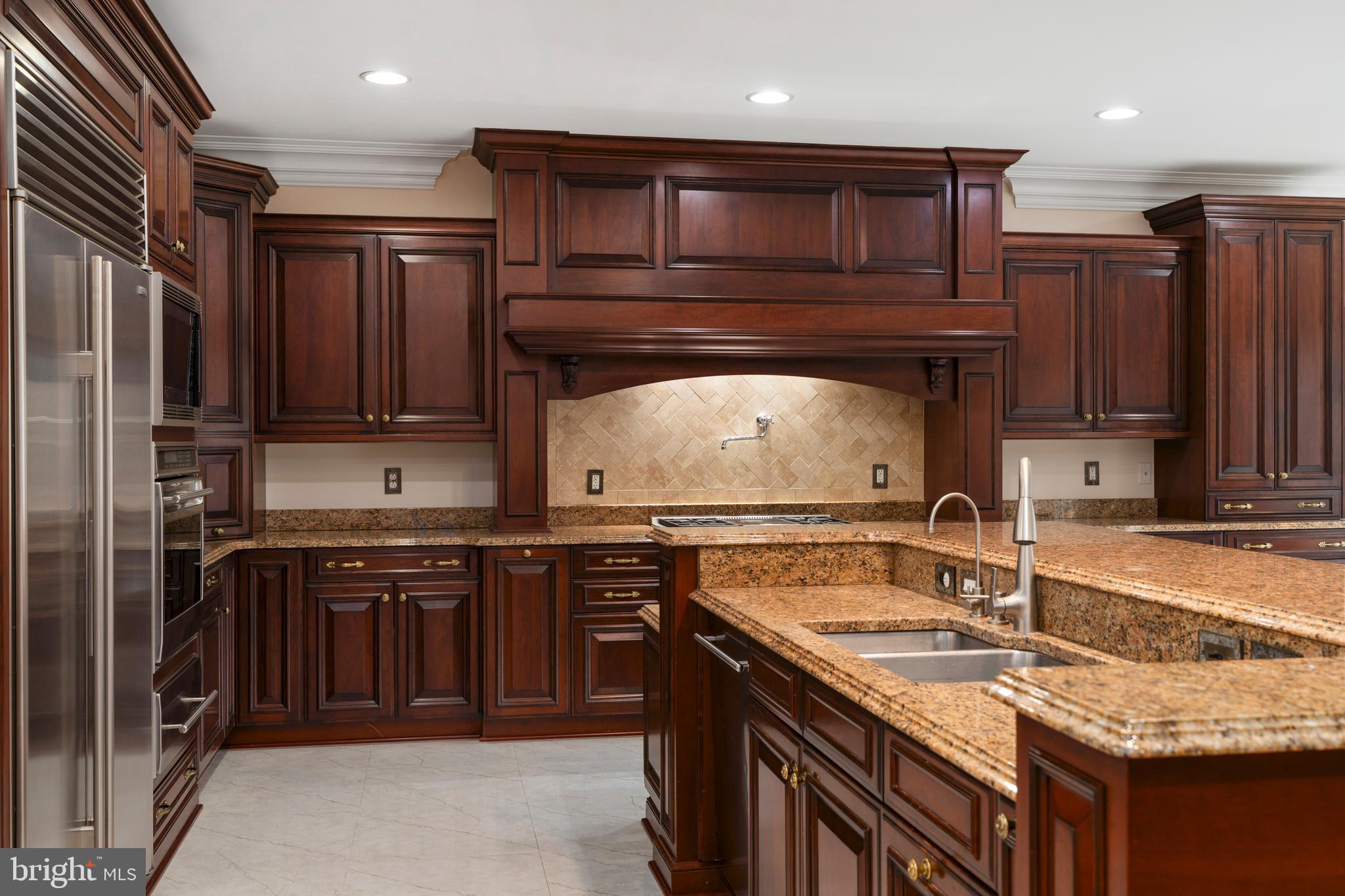 1410 Falls Crest Drive Fallston, MD 21047 - Photo 13 of 58 a kitchen with stainless steel appliances granite countertop a sink stove and refrigerator