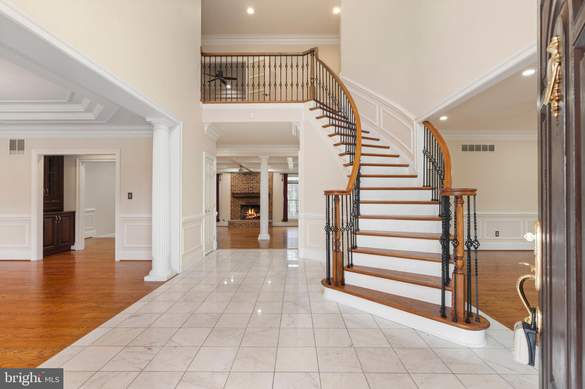 1410 Falls Crest Drive Fallston, MD 21047 - Photo 2 of 58 a view of a hallway with entryway and hall with wooden floor