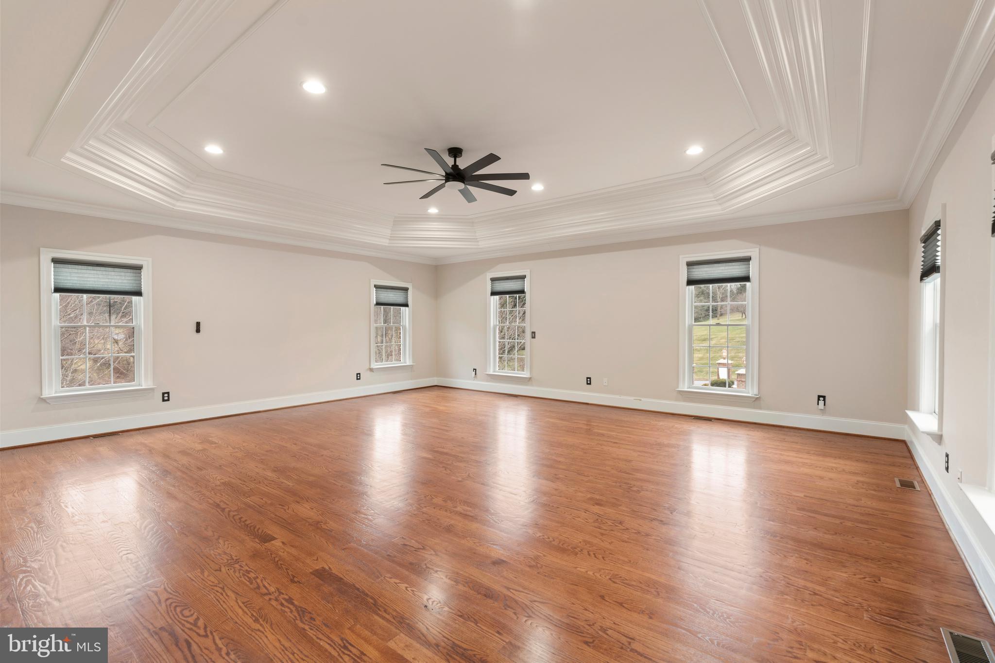 1410 Falls Crest Drive Fallston, MD 21047 - Photo 21 of 58 an empty room with wooden floor and windows