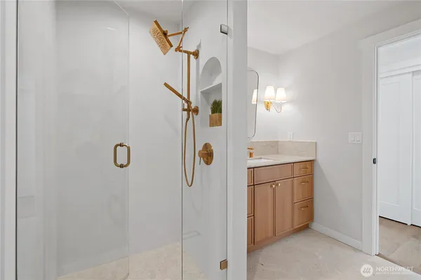 a bathroom with a shower and a mirror