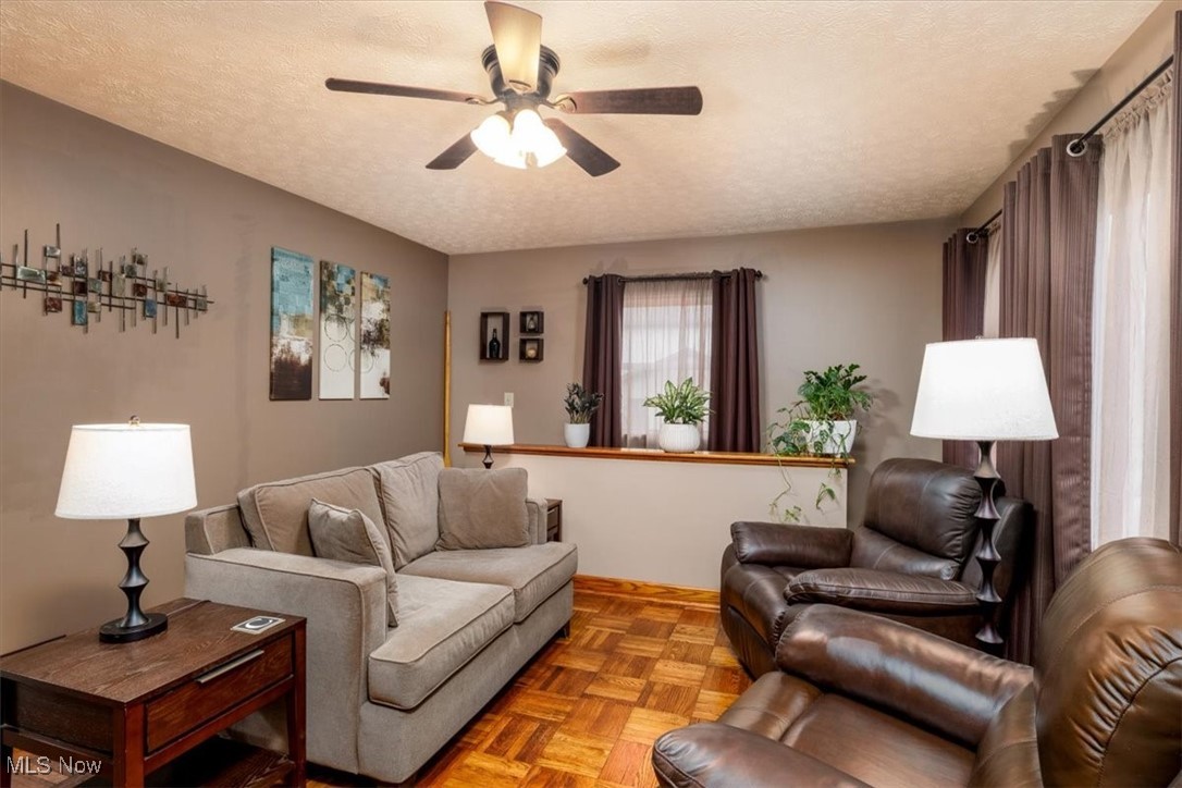 3831 Cook Road Rootstown, OH 44272 - Photo 10 of 25 Living area with parquet floor and access to basement living space