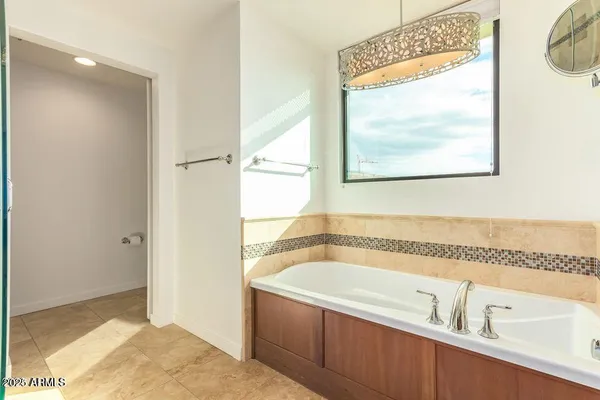 a bathroom with a tub and a sink