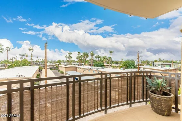 a view of a balcony with city view