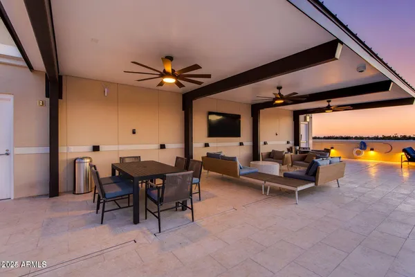 a view of a livingroom with furniture and a flat screen tv